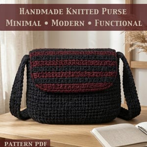 May include: A handmade knitted purse featuring a solid black body and a flap with horizontal stripes in black and dark red. The text on the image reads: HANDMADE KNITTED PURSE, MINIMAL • MODERN • FUNCTIONAL, and PATTERN PDF. The purse has a thick strap.