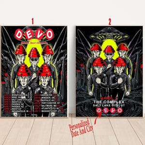 May include: Two framed concert posters featuring the band Devo. The posters have a black background with the band members in red hats. The first poster includes a tour date list. The second poster has a UFO and the text "The Complex Salt Lake City UT".