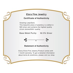 May include: A certificate of authenticity from Elora Fine Jewelry. The document is framed with a gold border and features text stating the jewellery is crafted in 925 silver with zircon stones. The base metal purity is 92.5% silver.
