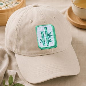 Pastel mahjong tile embroidery on a cap.