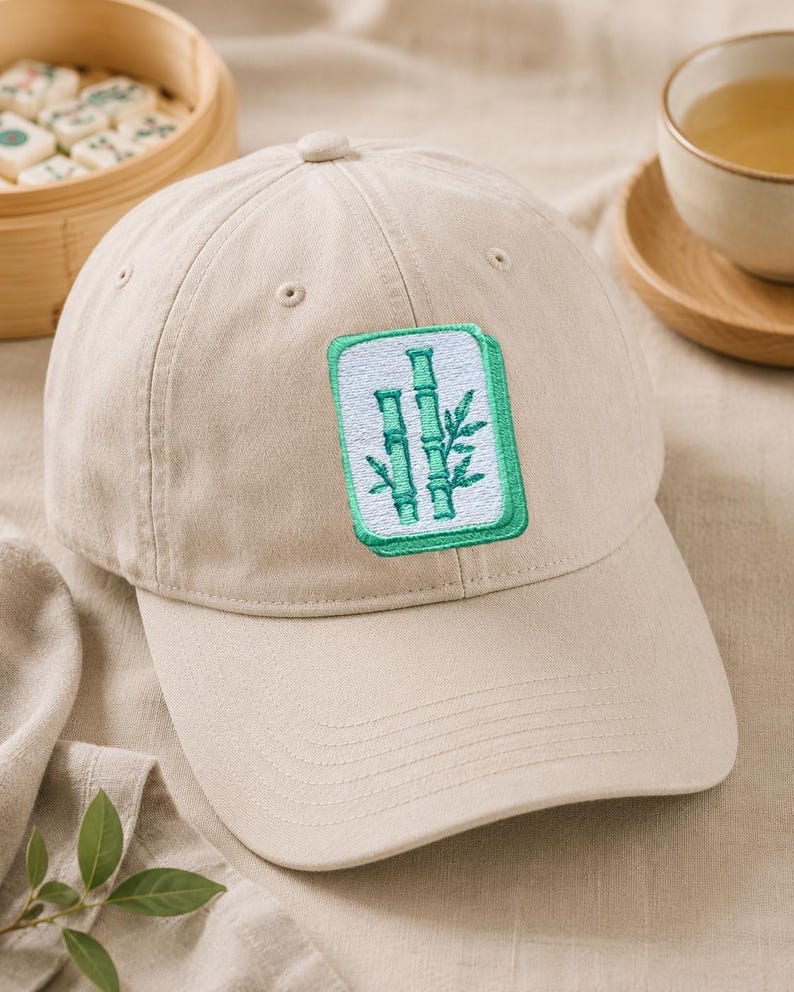Pastel mahjong tile embroidery on a cap.
