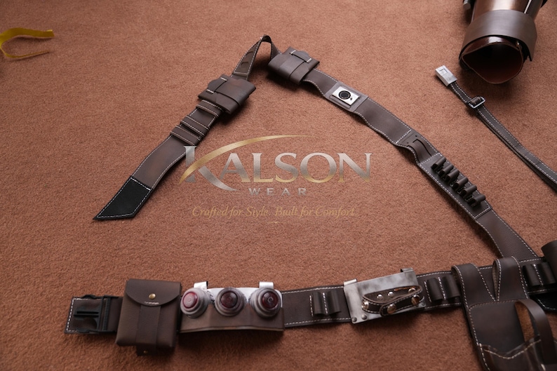 May include: Brown leather belt and accessories set. The set includes a belt with multiple pouches, a holster, and straps. The leather is stitched with white thread. The accessories are likely for cosplay or costume use.