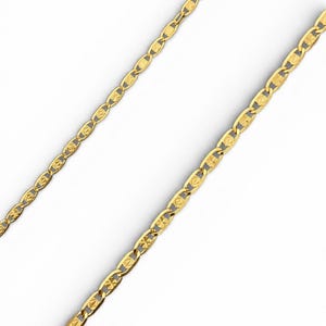 May include: Two gold-colored necklaces with a repeating oval and starburst design. The chains are displayed diagonally against a white background. The jewelry is likely made of metal and is suitable for wearing.