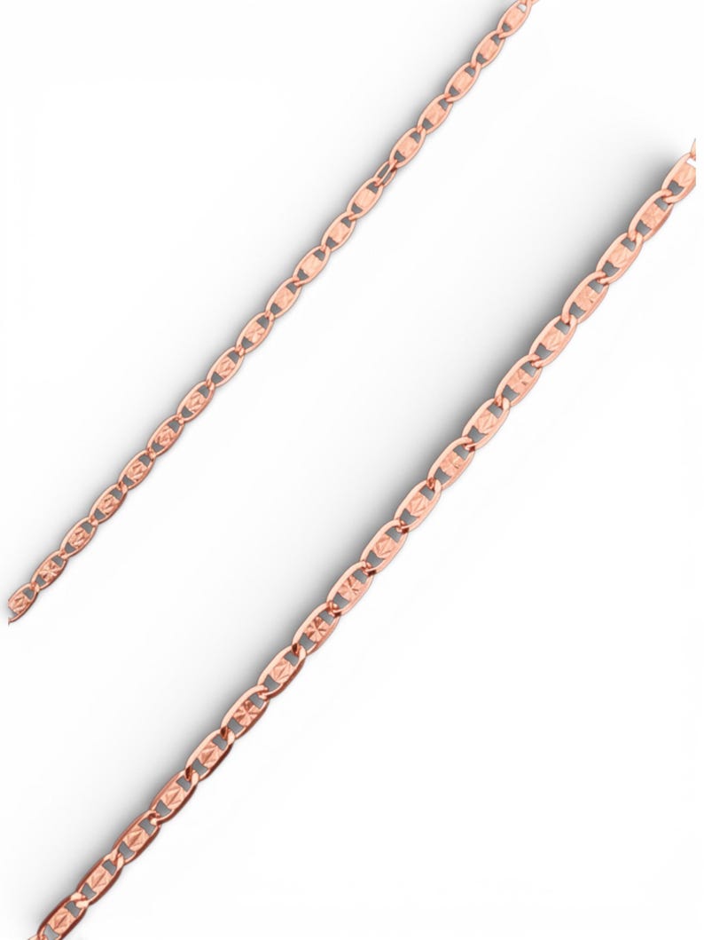 May include: Rose gold chain necklace with a repeating oval link design. The links have a textured pattern. The necklace is displayed on a white background.