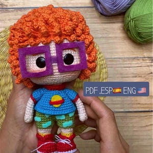 Carlitos Amigurumi Pattern: Create this iconic Rugrats character with this PDF guide. Includes a pattern for his bear. Spanish/English language