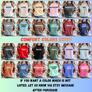 May include: A collection of twenty-four short-sleeve crew neck t-shirts in various solid colours, each labelled with its specific colour name. The text COMFORT COLORS CC1717 appears at the top, with instructions for custom colour requests below.