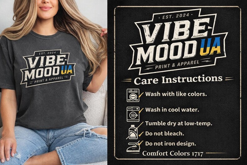 May include: Dark gray t-shirt with the text "VIBE MOOD UA PRINT & APPAREL" in a white and yellow design. The shirt also has care instructions on a black background.