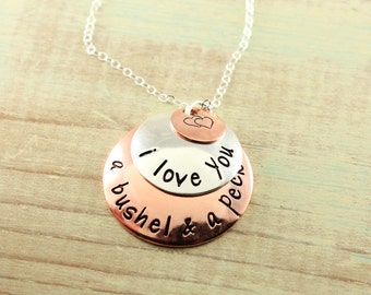 Hand stamped copper and sterling silver domed pendant necklace...."I love you a bushel & a peck"