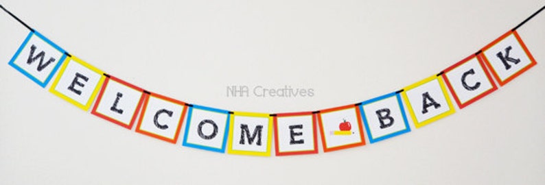 May include: A colourful welcome back banner with the words "WELCOME BACK" in black letters on a white background. The banner is made of individual squares with alternating colours of red, yellow, blue, and orange. The squares are connected by a black string. There is a small red apple and a yellow pencil on one of the squares.