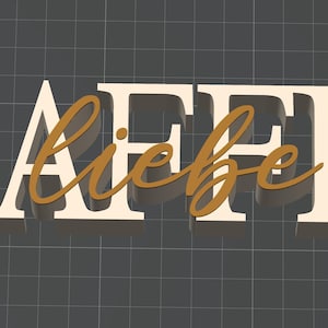 May include: A decorative sign with the German words "Kaffee Liebe" in cream-coloured block letters and gold script, meaning "Coffee Love." Three coffee beans are to the right. The sign is on a dark grey grid background.