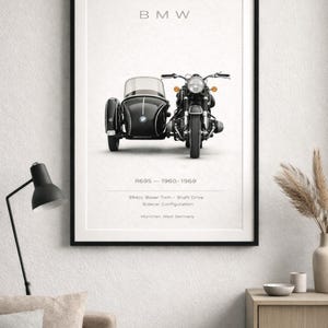 May include: Framed print featuring a black BMW motorcycle with a sidecar. The image includes the text "BMW" at the top and "R69S - 1960-1969" below the motorcycle. Additional text details the engine and configuration.