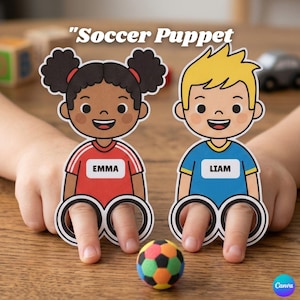 May include: Two paper finger puppets labeled Soccer Puppet, one featuring a character named Emma in a red jersey and one featuring a character named Liam in a blue jersey, each with two circular cutouts for fingers and a small foam soccer ball.