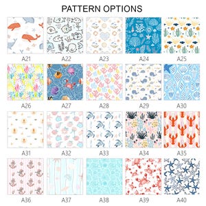 May include: A selection of fabric pattern options featuring various marine life and nautical themes. Designs include whales, fish, coral, starfish, and lobsters in a variety of colors. The text "PATTERN OPTIONS" is at the top.