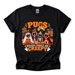 May include: A black t-shirt featuring a graphic of four pugs in Halloween costumes, including a ghost, a witch, a skeleton, and a vampire. The text reads PUGS BECAUSE PEOPLE ARE CREEPY, TRICK OR TREAT, and GOOD DOGS SCARE BAD PEOPLE with pumpkins.