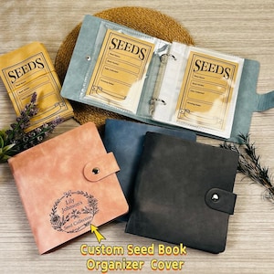 May include: Seed organiser covers in pink, blue, and black. The covers have button closures and are personalised. An open organiser displays seed packets with the word "SEEDS". The text "Custom Seed Book Organizer Cover" is also visible.