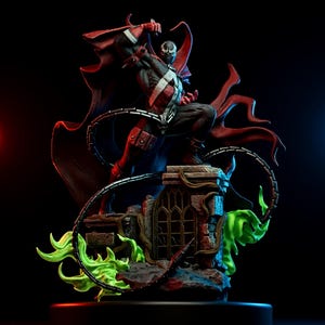 May include: A detailed figurine of the comic book character Spawn, posed dynamically on a crumbling stone structure. The figure is clad in a black and red costume with a white cross design. A red cape and a chain are featured, with green energy effects.