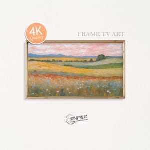 Könnte beinhalten: Gerahmtes Landschaftsgemälde mit goldenem Rahmen. Das Kunstwerk zeigt ein Feld mit Wildblumen im Vordergrund, das in gelbe und grüne Felder übergeht, mit einem rosa-orangenen Himmel. Der Text "FRAME TV ART" ist sichtbar.
