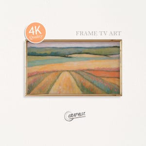 May include: A framed landscape painting with a gold frame. The artwork depicts a field with rows of colorful crops in shades of yellow, orange, and green. The sky is a muted gray. The text "FRAME TV ART" is visible.