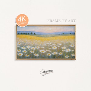Puede incluir: Pintura de paisaje enmarcada de un campo de margaritas bajo una suave puesta de sol. La obra de arte presenta un marco dorado, el texto "FRAME TV ART" y una insignia de "4K Quality". La firma del artista, "GRAPHIE", está en la parte inferior.