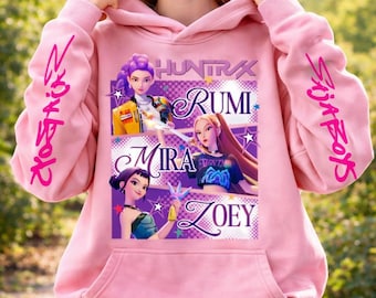 May include: Pale pink hoodie with a graphic of four animated female characters named Rumi, Mira, and Zoey. The sleeves have the text "Slay Boys" in pink. The hoodie has a front pocket.