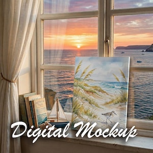 Puede incluir: Una impresión en lienzo de una escena de playa con un pájaro, dunas de arena y olas del océano. La impresión se muestra en un alféizar con libros, un modelo de velero y el texto "Digital Mockup". El fondo muestra una puesta de sol sobre el mar.