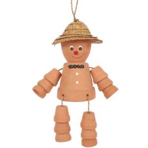 May include: A charming terracotta pot figure wearing a straw hat, with a red nose and a smiling face. The arms and legs are made of stacked pots, and the figure is suspended by a string. A delightful garden ornament.