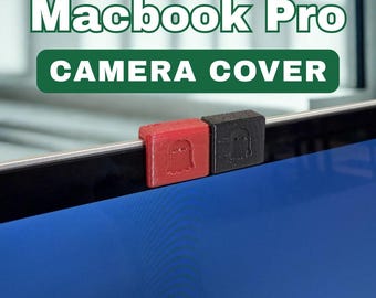 May include: A red and black camera cover for a Macbook Pro. The red cover has a ghost design, and the black cover has a similar design. The text "Macbook Pro CAMERA COVER" is in the background.