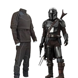May include: Two Mandalorian costumes. One is a dark grey jumpsuit with white stitching. The other is a full suit of armour with a helmet, chest plate, and utility belt. The armour is primarily dark grey and black.