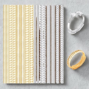 May include: A selection of jewellery items, including gold and silver rings and chain designs. The rings feature clear gemstones and textured bands. The chains are arranged in vertical rows, showcasing various link styles and metallic finishes.