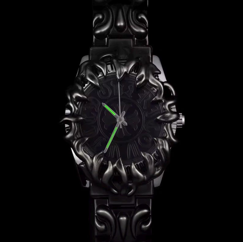 May include: Black wristwatch with an ornate, dark design. The watch face features a detailed pattern and bright green hands. The watch band and bezel have a matching, decorative style. The watch is set against a black background.