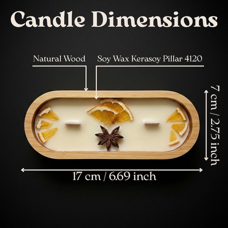 May include: An oval candle in a natural wood container with soy wax, two wooden wicks, dried orange slices, and a star anise. Text reads Candle Dimensions, Natural Wood, Soy Wax Kerasoy Pillar 4120, 7 cm / 2.75 inches, and 17 cm / 6.69 inches.