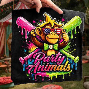 May include: Black t-shirt featuring a cartoon monkey wearing sunglasses with an American flag design and a green bow tie. The monkey is holding two baseball bats. The words "Party Animals" are written in colorful, dripping letters.