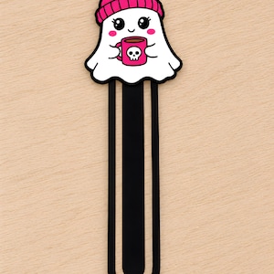 Cute girl ghost 3D printed bookmark wearing a pink beanie and holding a pink skull coffee mug.