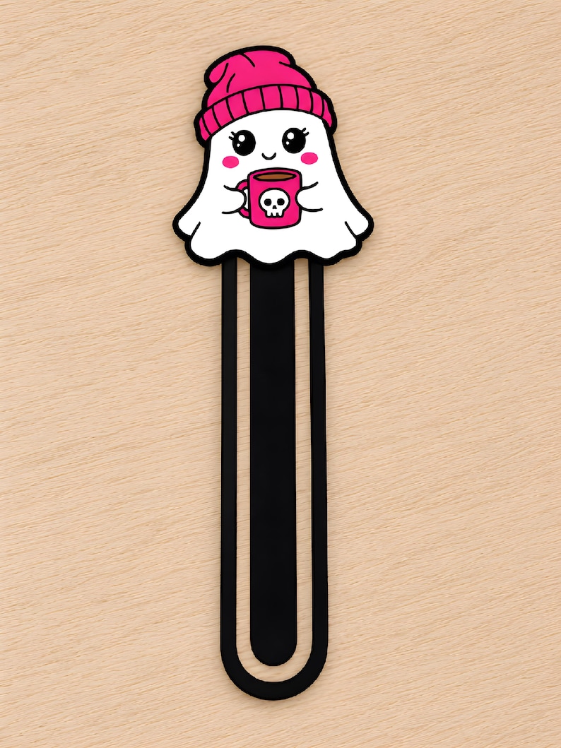 Cute girl ghost 3D printed bookmark wearing a pink beanie and holding a pink skull coffee mug.