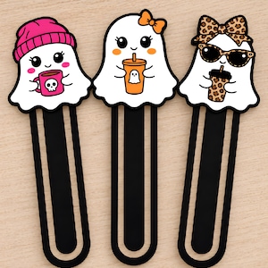 Set of three cute girl ghost bookmarks with pink beanie and mug, orange bow and drink, and leopard bow with sunglasses.