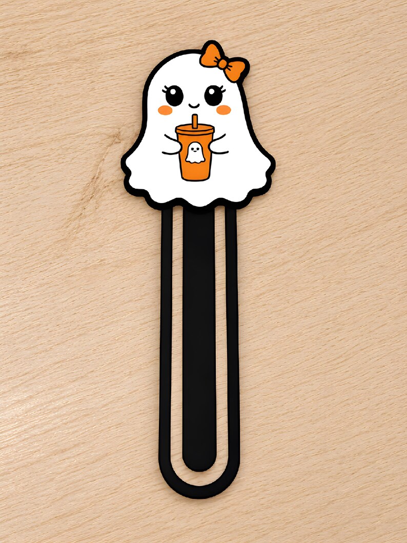 Cute girl ghost 3D printed bookmark with orange bow, orange cheeks, and ghost-themed drink cup.