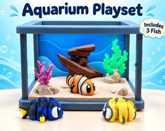 Juego de acuario en miniatura con figuras de peces payaso y peces ángel, escena de coral.