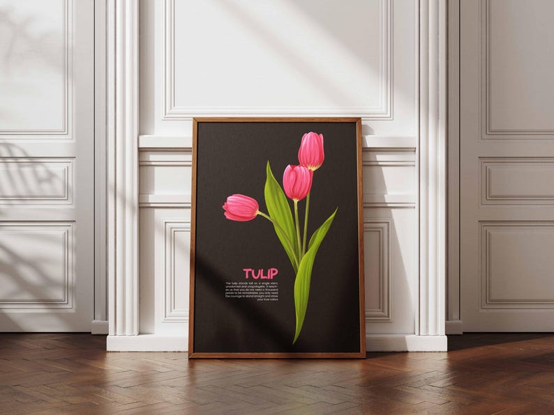 May include: A framed art print featuring a stylized illustration of three pink tulips with green leaves against a black background. The word "TULIP" is displayed in pink text. The frame is a warm brown color.