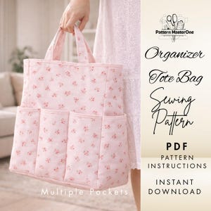 May include: A pink floral tote bag with multiple pockets is held by a person. The bag has a matching floral pattern and sturdy handles. Text on the image reads "Organizer Tote Bag Sewing Pattern PDF Pattern Instructions Instant Download Multiple Pockets."