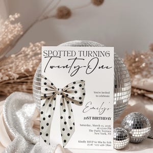 May include: A rectangular birthday invitation card featuring the text SPOTTED TURNING Twenty-One, a large cream-colored bow with black polka dots, and event details including the date March 13, 2026, location The Party Terrace, and RSVP contact info.
