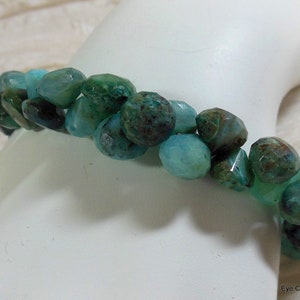 Gorgeous aquamarine bracelet with hand cut aquamarine onion shaped beads with white bronze toggle