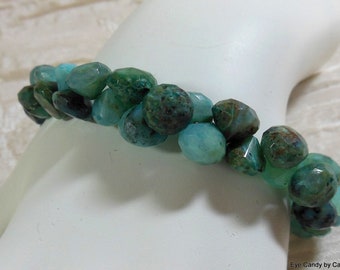 Gorgeous aquamarine bracelet with hand cut aquamarine onion shaped beads with white bronze toggle