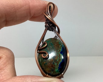 Beautiful Chrysocolla pendant, wire wrapped in copper and antiqued with a patina.