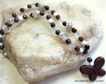 Brown butterfly necklace, brown, black and white beads with argentium sterling silver love knots