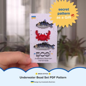 May include: A handmade card with beaded fish and a crab design. The fish are silver and black, the crab is red. The card includes the text "secret pattern as a Gift" and "Underwater Bead Set PDF Pattern".