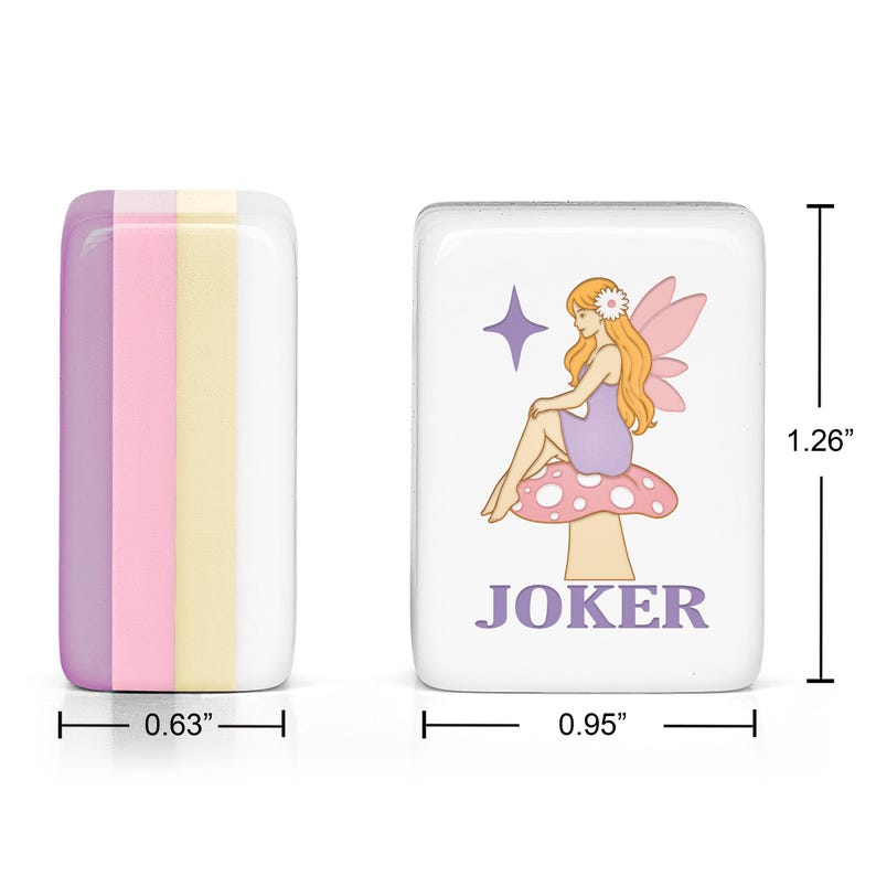 May include: Two rectangular mahjong tiles. One tile shows a side view with vertical stripes of purple, pink, and yellow. The other tile features a white face with a graphic of a fairy sitting on a mushroom, a purple star, and the text JOKER. Dimensions are 1.26 inches by 0.95 inches by 0.63 inches.