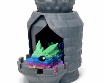 May include: A gray 3D-printed castle with a colorful dragon inside. The dragon has a rainbow color scheme with green, blue, and purple hues. The castle has a detailed brick design and a turret.