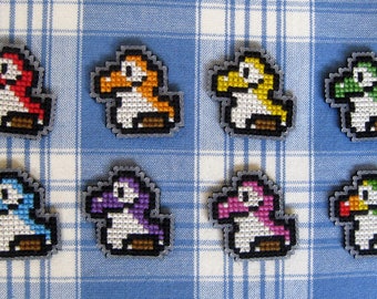 Cross stitched pin badge: baby yoshi