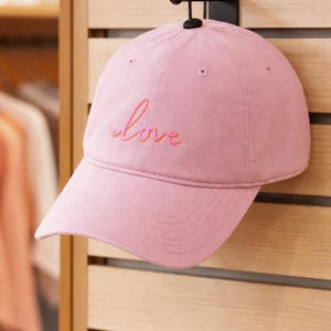 May include: A set of three ceramic mugs with a speckled, matte finish. The mugs are in shades of cream, light gray, and dark gray. Each mug has a simple, minimalist design, perfect for coffee or tea.