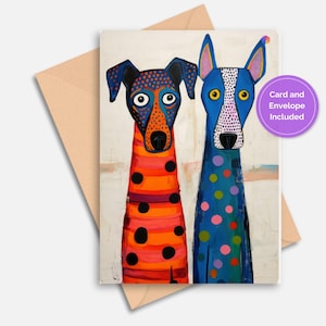 May include: A greeting card with two colourful dog portraits. One dog is orange and red with black spots, the other is blue with polka dots. The card includes an envelope. Text on the card reads "Card and Envelope Included."